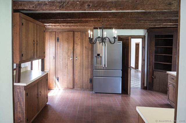 131 Cow Hill Rd, Clinton, CT 06413 - unfurnished dining area with wood walls, an inviting chandelier, dark floors, and beam ceiling