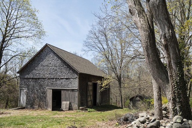 131 Cow Hill Rd, Clinton, CT 06413 - view of home's exterior with an outbuilding, a yard, and a barn