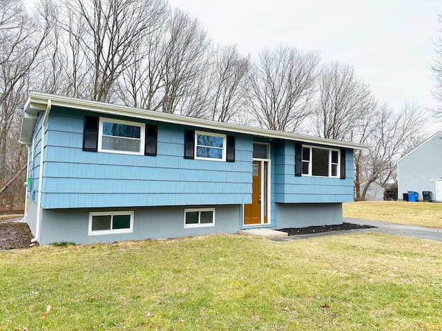 bi-level home with a front yard