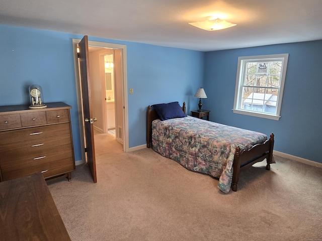 bedroom featuring light carpet