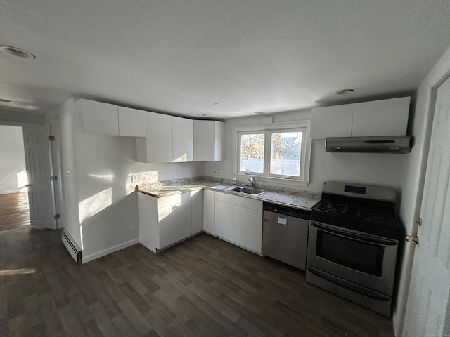 kitchen with white cabinetry, sink, dark wood-type flooring, stainless steel appliances, and a baseboard heating unit