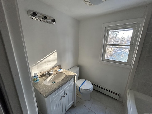 bathroom with tile patterned floors, vanity, toilet, and a baseboard radiator