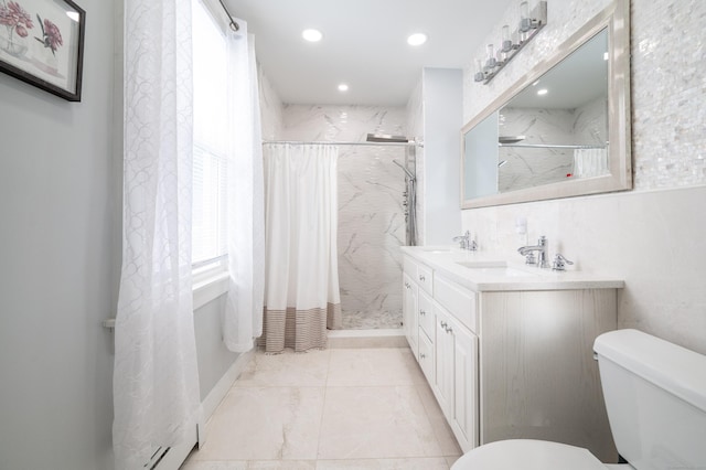 bathroom with curtained shower, toilet, and vanity