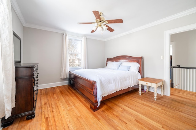 bedroom featuring ceiling fan, light hardwood / wood-style floors, and ornamental molding