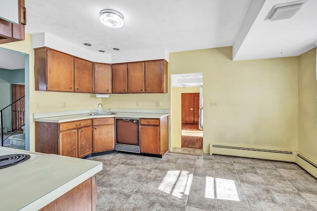 kitchen with brown cabinets, a sink, a baseboard radiator, dishwashing machine, and light countertops