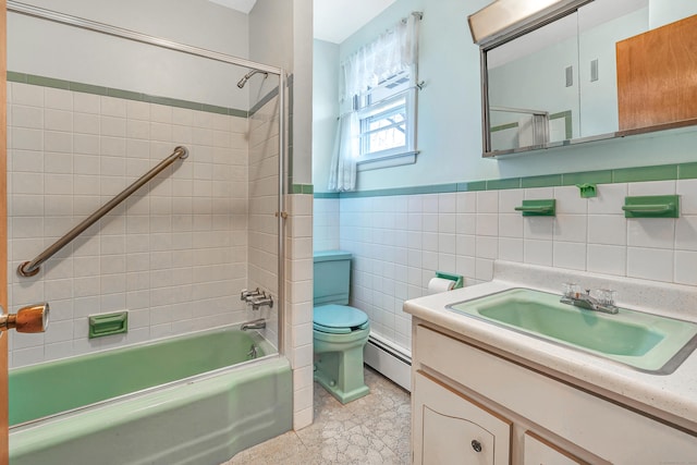 full bathroom with a baseboard heating unit, toilet, vanity, bathing tub / shower combination, and tile walls