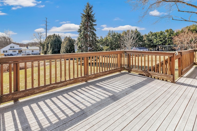 wooden deck with a yard