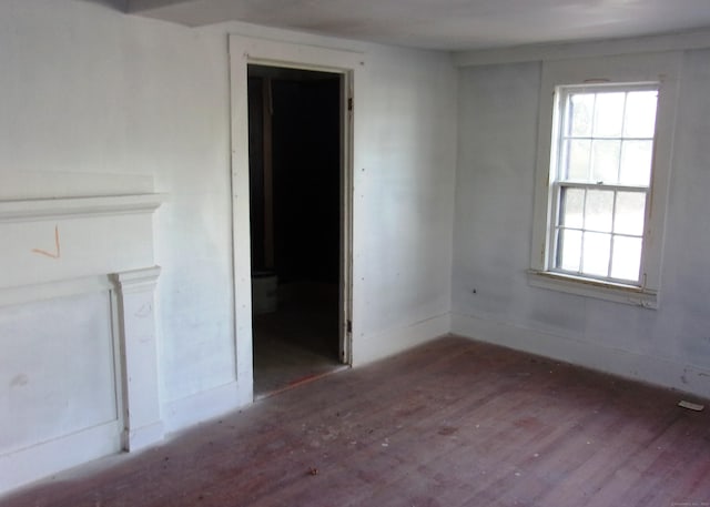 spare room featuring dark hardwood / wood-style flooring