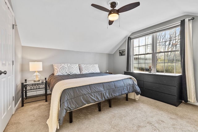 bedroom featuring ceiling fan, light carpet, and vaulted ceiling