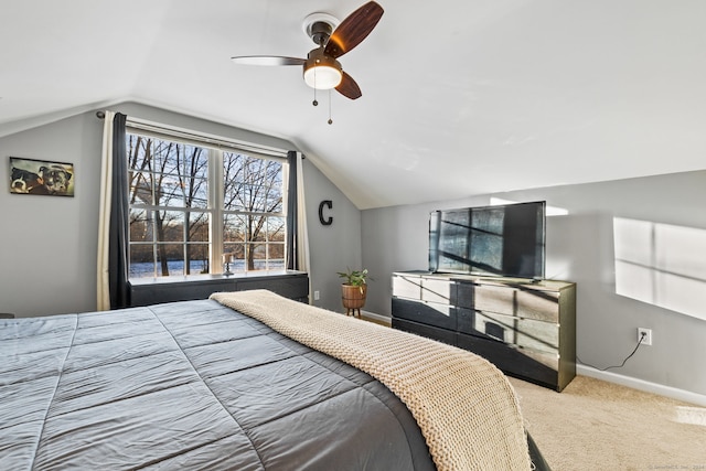 bedroom with carpet flooring, ceiling fan, and vaulted ceiling