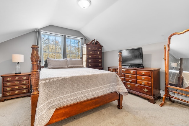 carpeted bedroom with vaulted ceiling