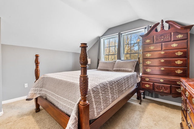 carpeted bedroom featuring vaulted ceiling