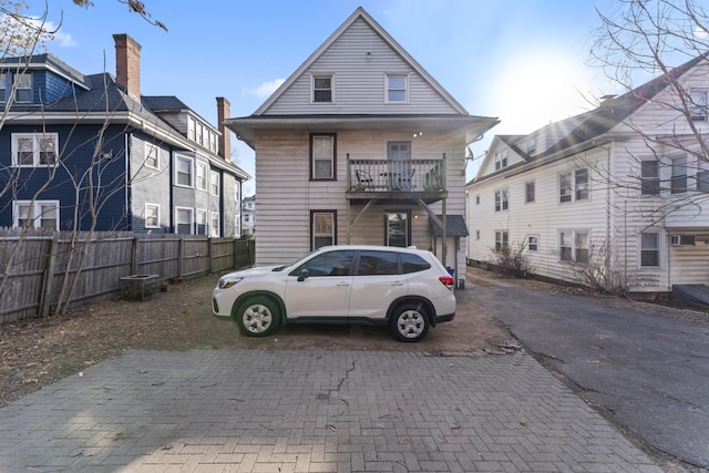 rear view of house featuring a balcony