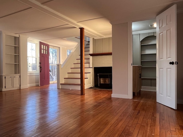 unfurnished living room with wood-type flooring