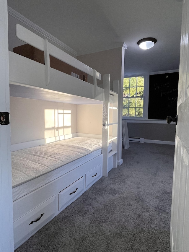 unfurnished bedroom with carpet flooring and a baseboard heating unit