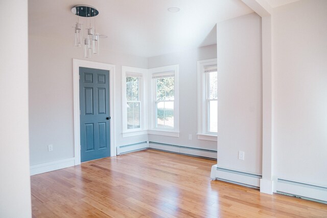 interior space with light hardwood / wood-style floors and a baseboard radiator