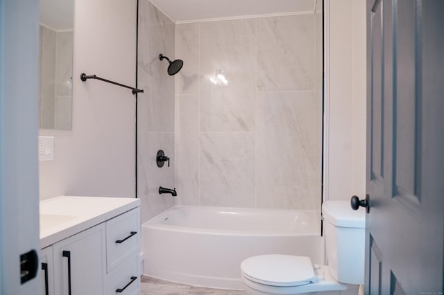 full bathroom featuring tiled shower / bath, vanity, and toilet