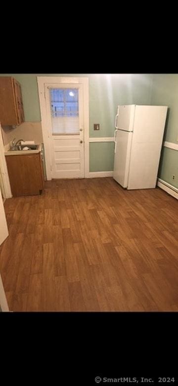 interior space featuring light hardwood / wood-style floors and a baseboard radiator