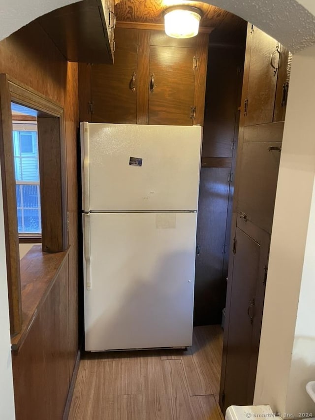 kitchen featuring white fridge and light hardwood / wood-style floors