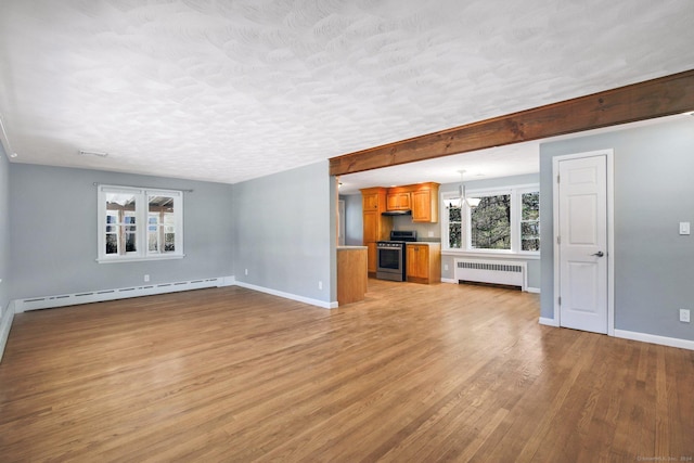 unfurnished living room with a textured ceiling, baseboard heating, light hardwood / wood-style floors, radiator heating unit, and a chandelier