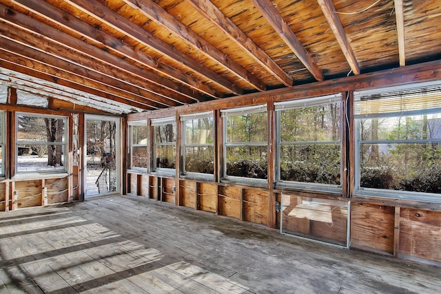 unfurnished sunroom featuring lofted ceiling