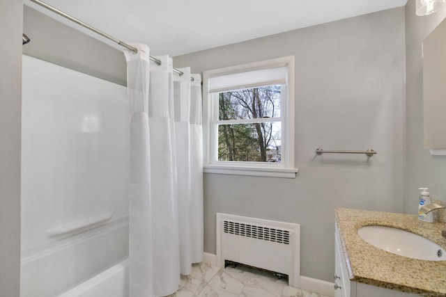 bathroom featuring vanity, radiator heating unit, and shower / bath combo with shower curtain