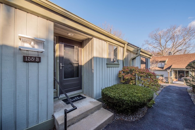doorway to property with board and batten siding