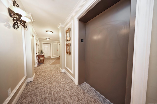 hallway with elevator and crown molding