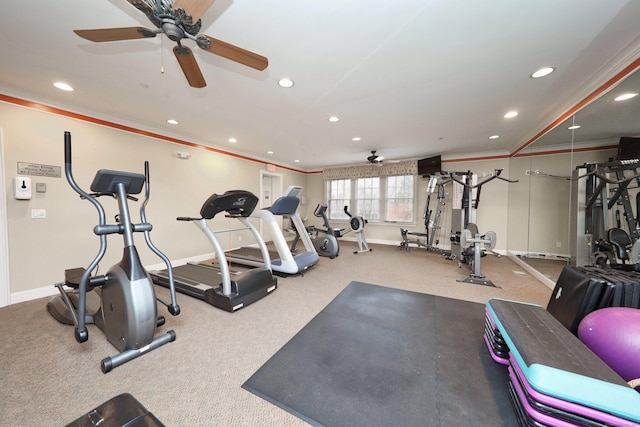 workout area with ceiling fan, light colored carpet, and ornamental molding