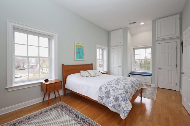 bedroom with light wood-type flooring