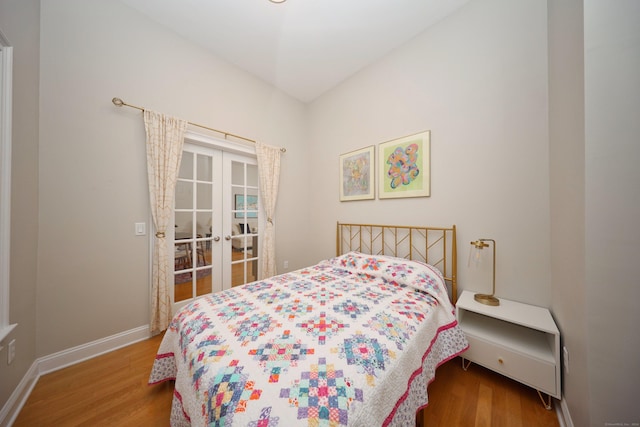 bedroom with hardwood / wood-style flooring