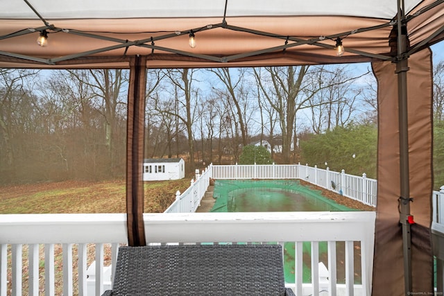 view of pool with a storage shed