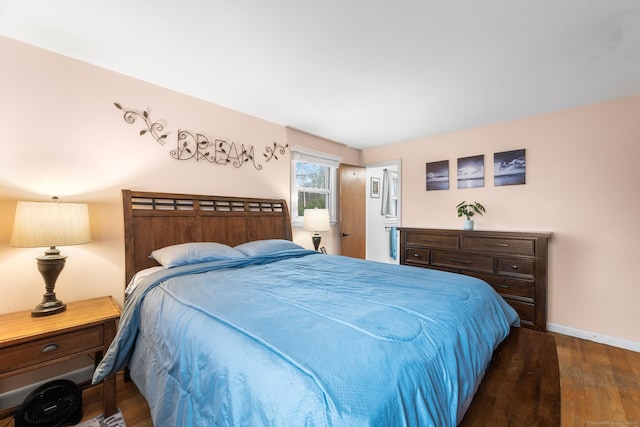 bedroom featuring dark wood-type flooring