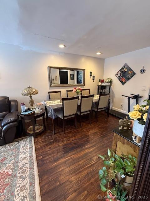 dining space featuring recessed lighting, wood finished floors, and baseboards