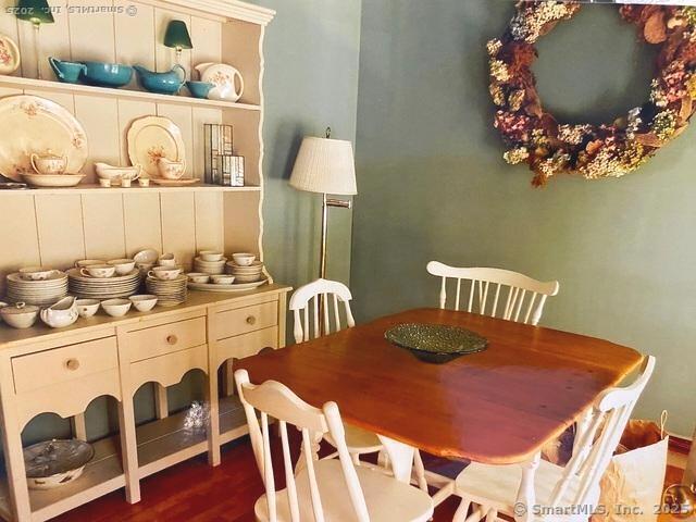 dining area with dark wood-type flooring