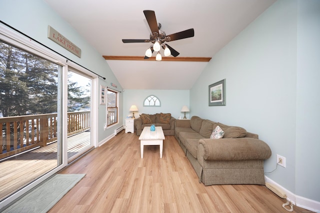 living room with vaulted ceiling with beams, light hardwood / wood-style floors, baseboard heating, and ceiling fan