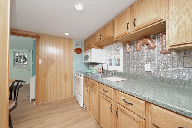 kitchen featuring light brown cabinets, white appliances, sink, and light hardwood / wood-style flooring