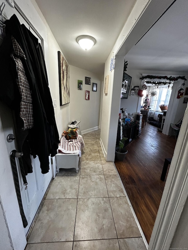 corridor featuring light tile patterned floors