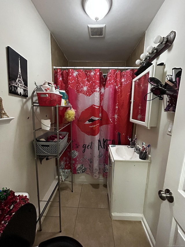 bathroom with tile patterned floors, vanity, and a shower with shower curtain