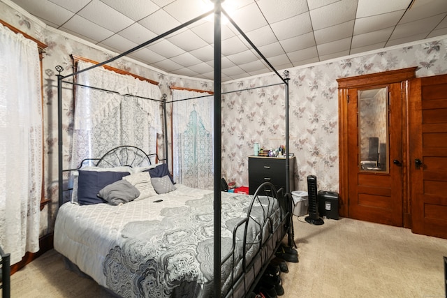 bedroom featuring carpet flooring and crown molding