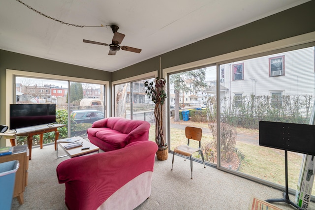 sunroom / solarium with ceiling fan