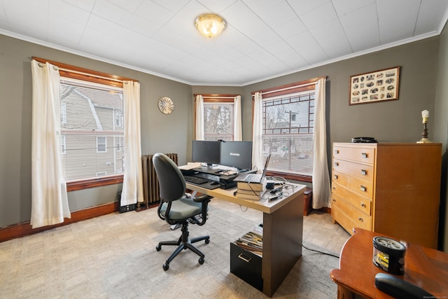 home office featuring crown molding and light carpet