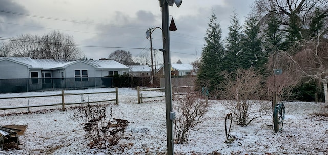 view of yard covered in snow