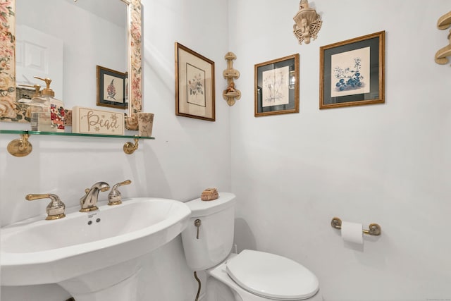 bathroom featuring sink and toilet