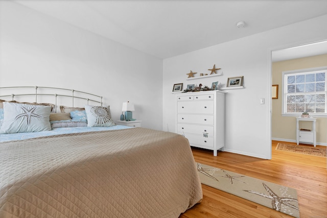 bedroom with hardwood / wood-style flooring