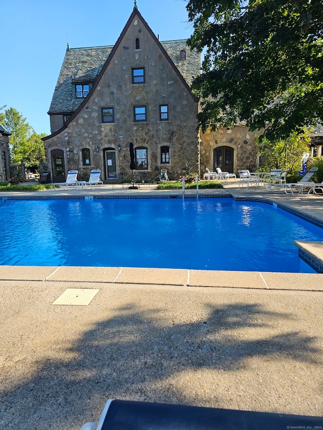 view of pool featuring a patio area