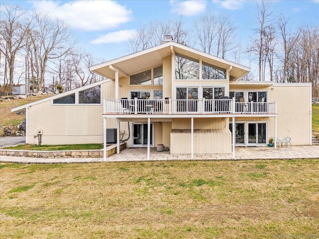 back of house with a yard, a deck, central AC unit, and a patio area