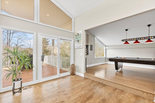 playroom with hardwood / wood-style floors, lofted ceiling, and pool table