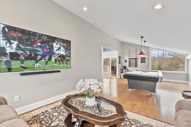 rec room featuring light hardwood / wood-style floors, vaulted ceiling, and pool table