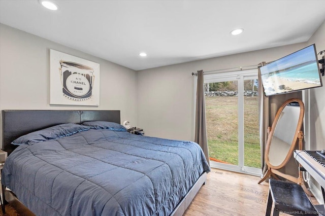 bedroom featuring access to outside and light hardwood / wood-style floors